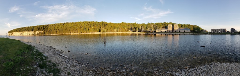 A view looking across Snail Shell Harbor toward the ghost town of Fayette, Michigan, to the right and the limestone cliffs of the Niagara Escarpment to the left.