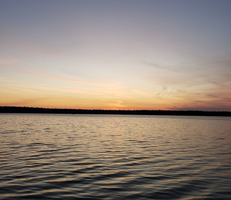 image of the sun setting beyond North Trout Lake in northern Wisconsin