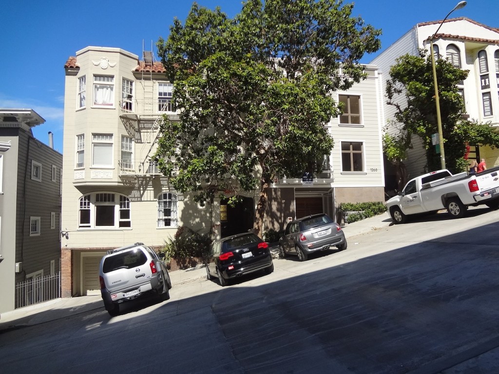 a typical street in San Francisco, descending a hill at a thirty-degree angle