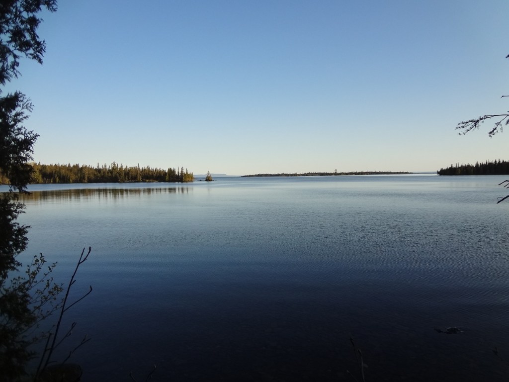 photo of Lane Cove, Isle Royale National Park - wooded islets are strung across the background and Sleeping Giant Provicial Park in Canada can be seen in the distant background
