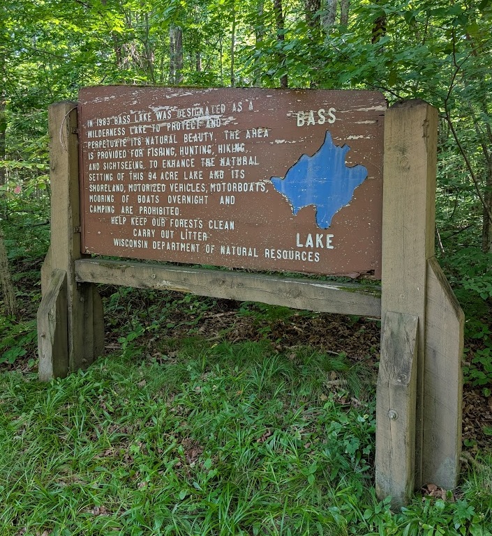 DNR sign posted at the trailhead to Bass Lake. 