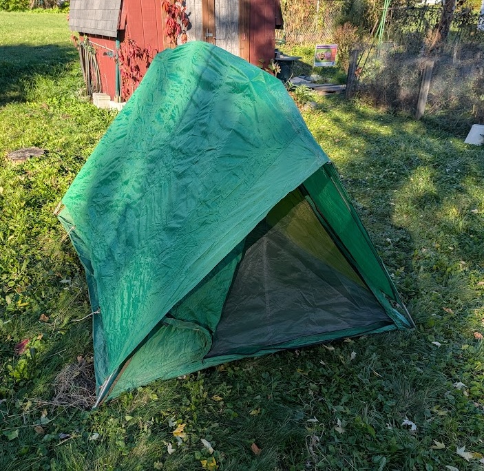 a 50-year-old green Eureka Timberline tent with rain fly