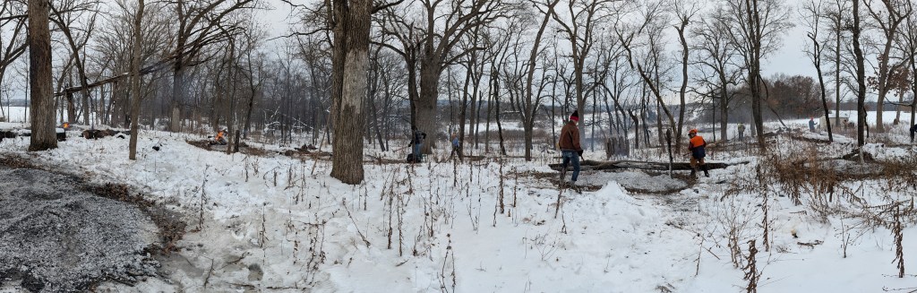 a panoramic photo of volunteers tending the various smoldering piles of burned buckthorn and honeysuckle they cut out of the wooded areas along the Ice Age Trail, University Ridge segment